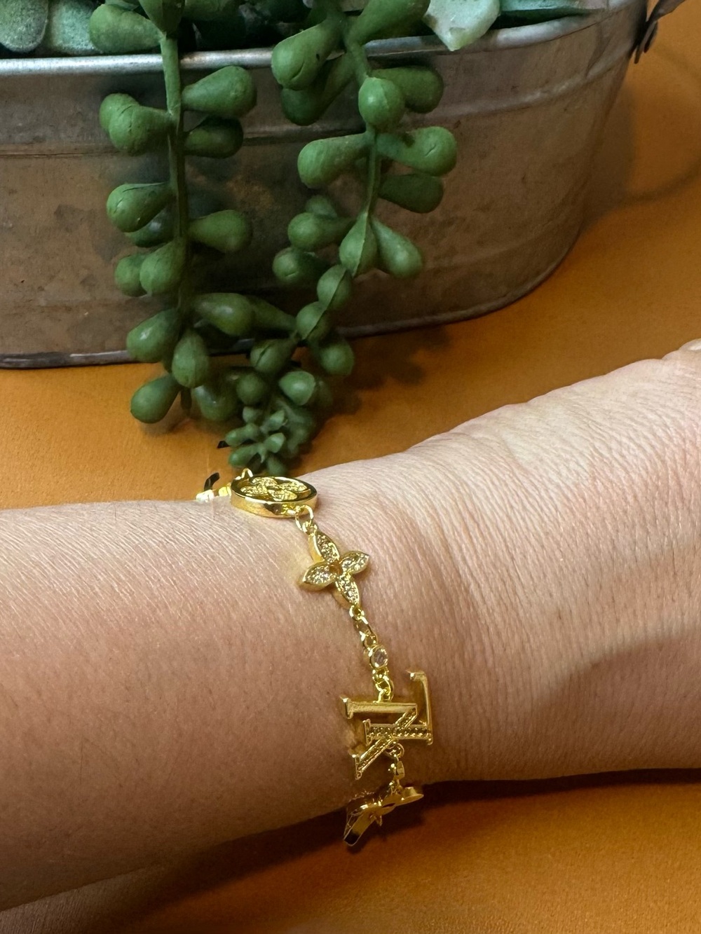 Louis Vuitton Gold Tone Monogram Charm Bracelet